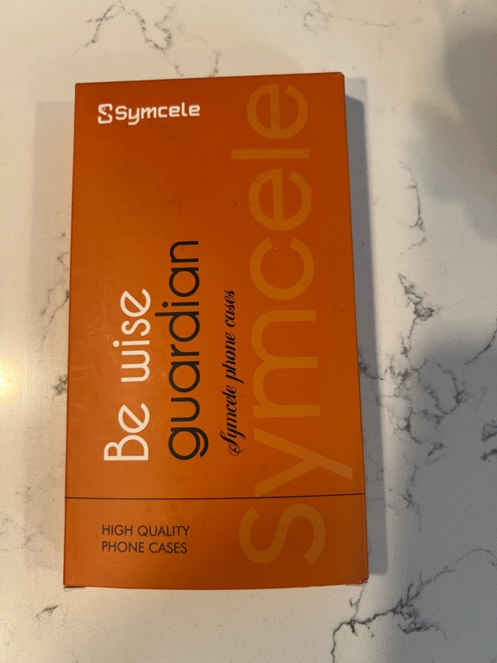Symcele Phone Case Packaging in Bright Orange